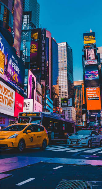 New York City taxis at Times Square New York City yellow taxis Times Square — NYC marketing agency